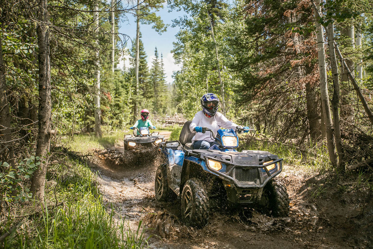 People riding ATVs